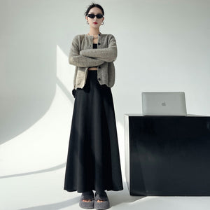 Black knitted pleated high-waisted A-line umbrella skirt with large hem
