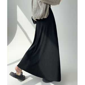 Black knitted pleated high-waisted A-line umbrella skirt with large hem